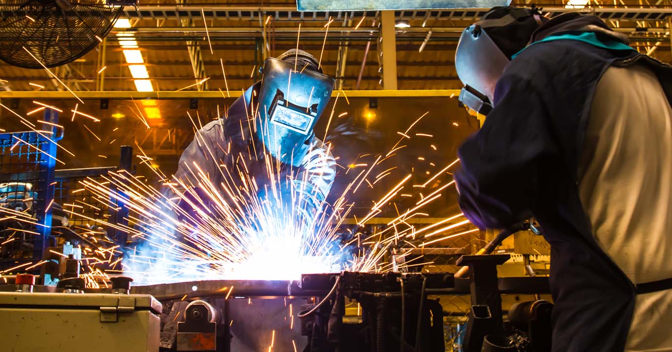 welder welding Industrial automotive part in car production factory